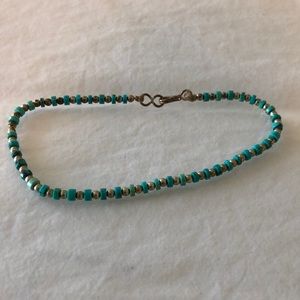 Turquoise and silver beaded anklet.